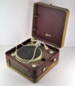 A late 1950s Bush four speed table record player, Garrard 4SP with built-in speaker,