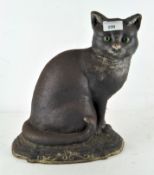 A painted cast iron cat doorstop, on stepped base,