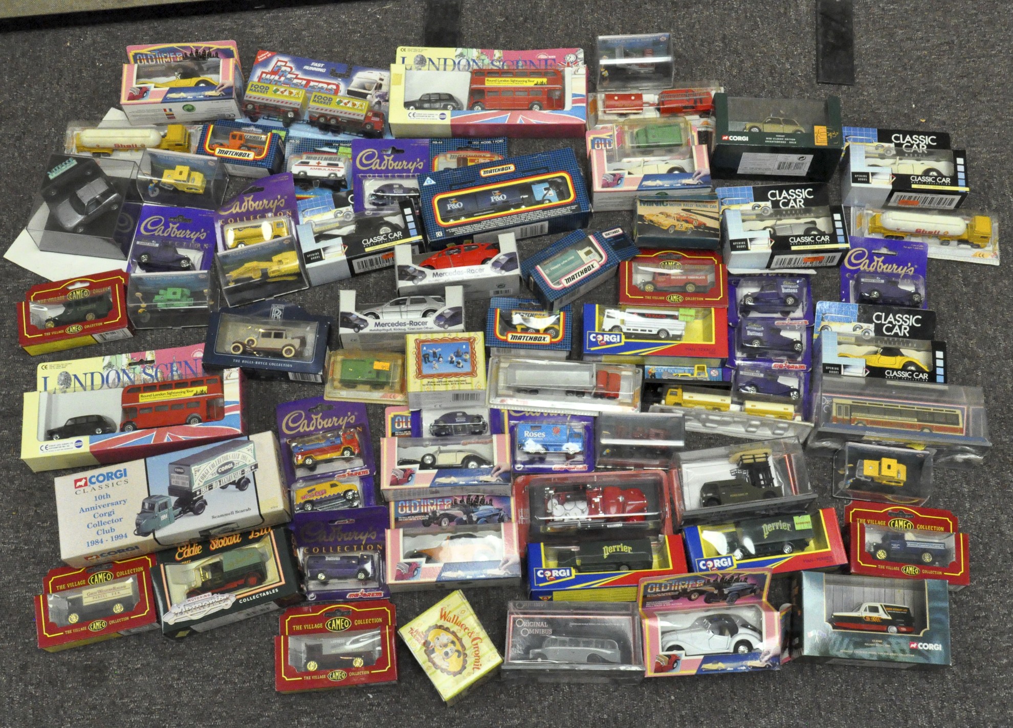 A quantity of boxed die-cast cars and vehicles (over 60),