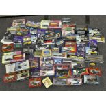 A quantity of boxed die-cast cars and vehicles (over 60),