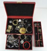 A quantity of costume jewellery comprising bangles, necklaces, pendants and more,