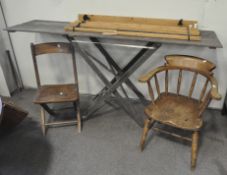 Two oak kitchen chairs, a hanging drying rack and a trestle table,