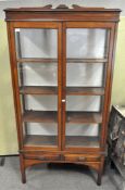 A large mahogany glazed display cabinet, double doors opening to reveal three shelves,