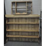A pine three shelf dresser top with a pine three compartment wall shelf