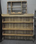 A pine three shelf dresser top with a pine three compartment wall shelf