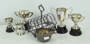 A selection of mid century silver plated trophies together with a small silver mug