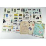 A group of stamps together with a selection of Brooke Bond picture cards,