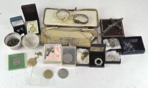 A selection of costume jewellery, necklaces, commemorative coins, a pair of earrings,