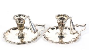 A pair of silver plated chamber candle sticks, late 19th century, in the Georgian style,