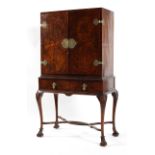 A 20th century brass mounted burr walnut cabinet on stand in the 17th century style,