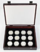 A collection of twelve commemorative silver proof coins, 925/1000, relating to Queen Elizabeth II,