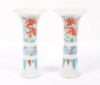 A pair of Chinese Doucai vases, Qianlong mark but probably later, of slender flaring form,