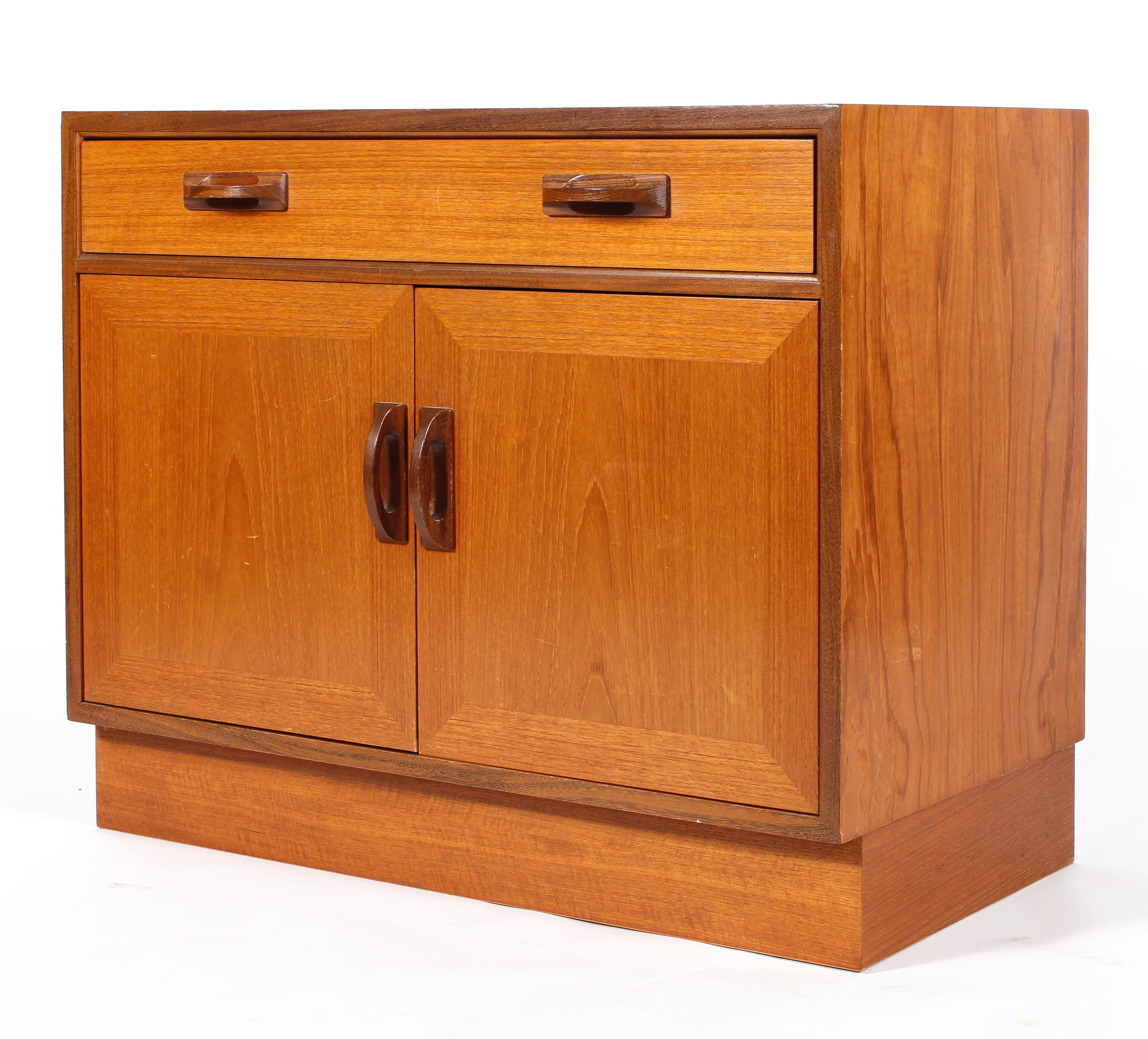 A G-Plan teak cupboard or small sideboard, a single drawer above a pair of cupboard doors,