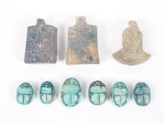 A collection of Egyptian faience amulets, comprising: six turquoise glazed scarab beetles,