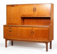 A G-Plan teak sideboard, with fall front cabinet and two door cupboard enclosing a shelf,