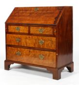 An 18th century mahogany and burr wood bureau,