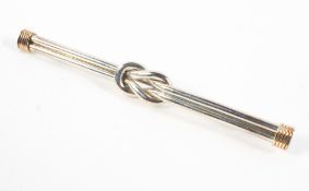 A sterling silver and gold knot bar brooch measuring approximately 70.0mm. Pin and revolver catch.