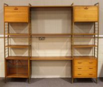 A Ladderax wall unit, with four uprights, two fall front units, a three drawer unit,