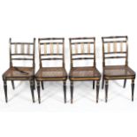 Four Regency chairs with vertical ribbing to the back and wicker seat,