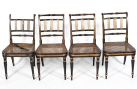 Four Regency chairs with vertical ribbing to the back and wicker seat,