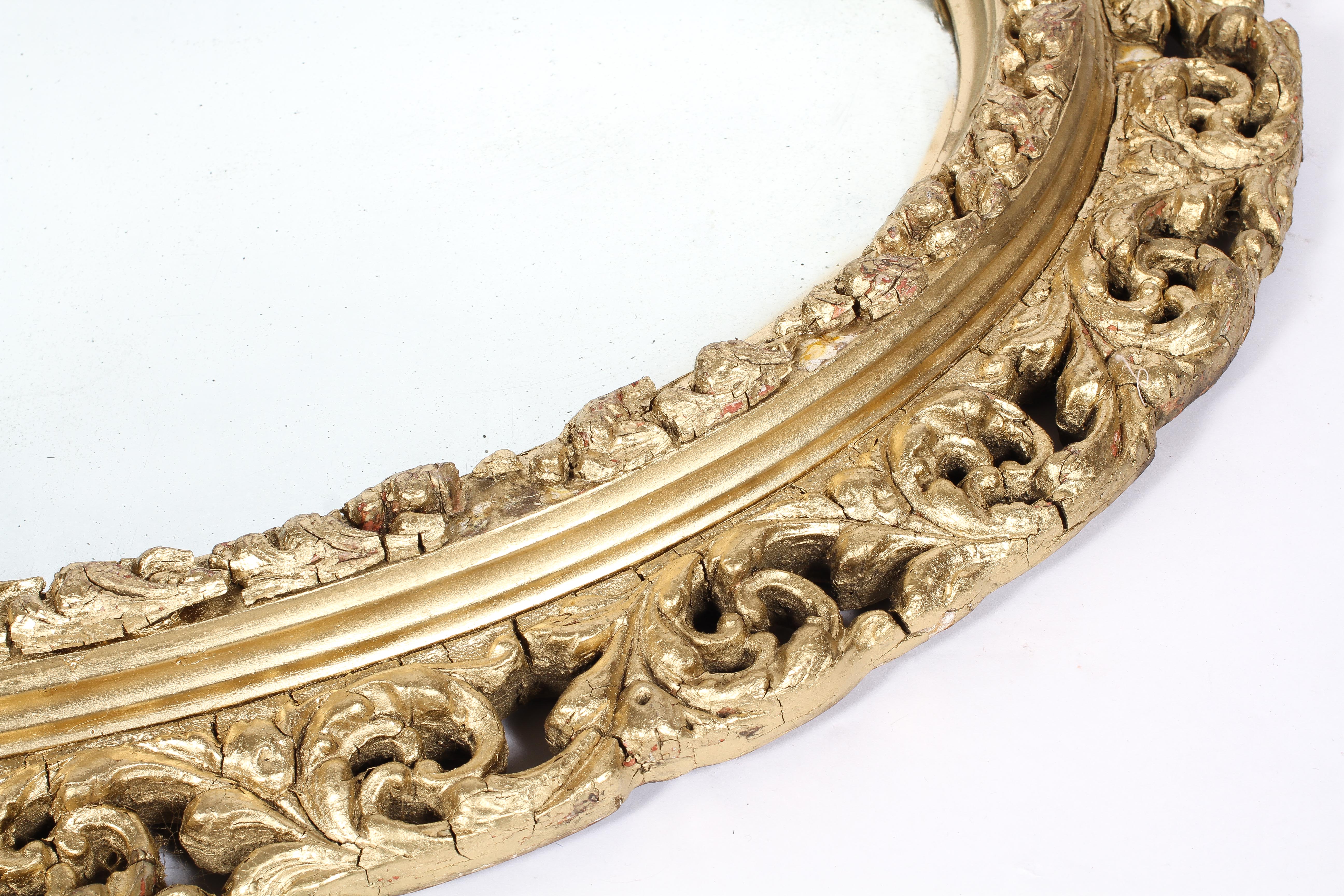 A Victorian gilt framed oval mirror, the plate inside a pierced, scrolling frame, - Image 2 of 2