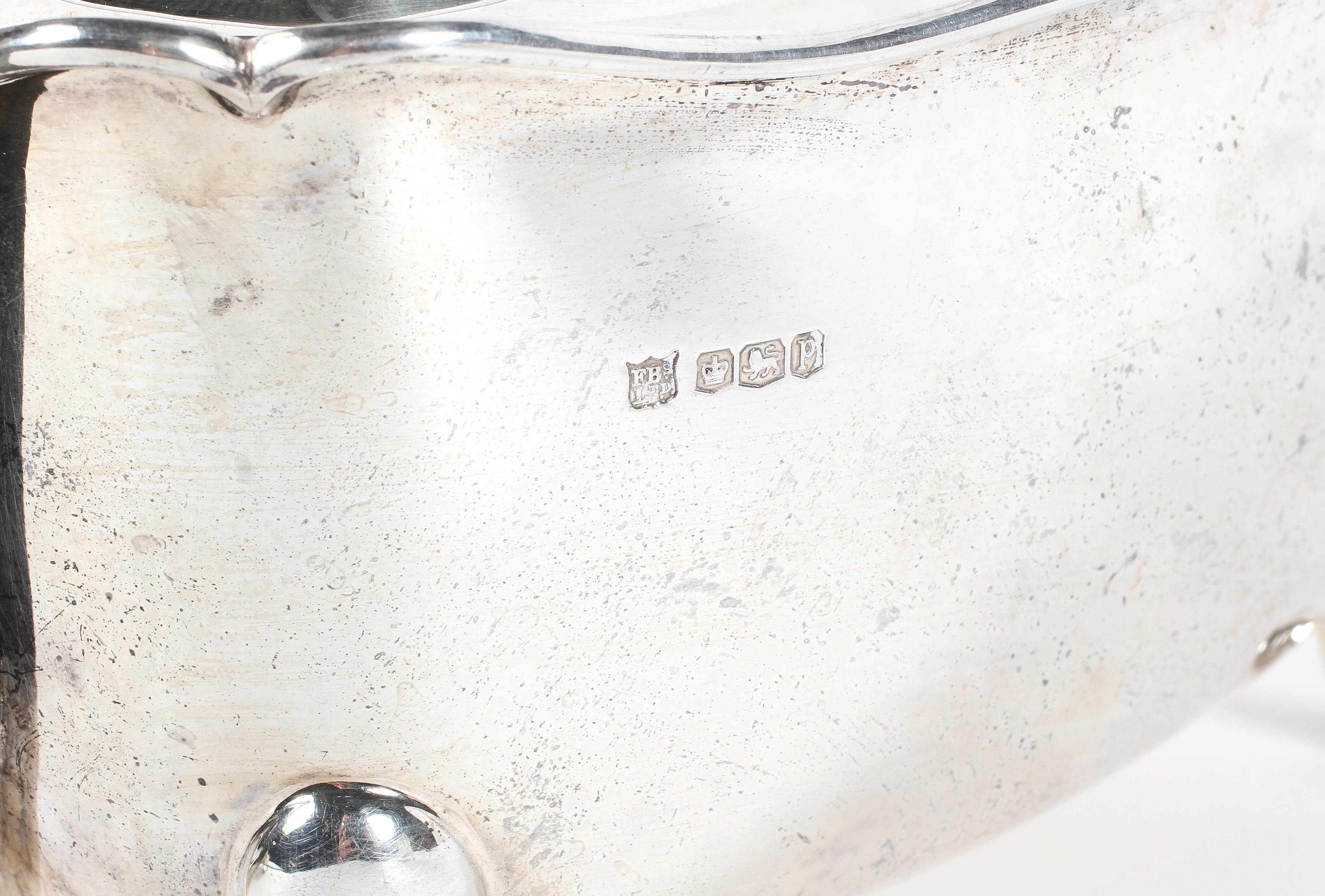 A George V three piece silver tea set, comprising teapot, twin handled sugar bowl and milk jug, - Image 2 of 2