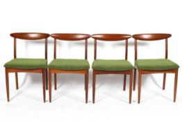 Four mid century Greaves and Thomas teak chairs, tapering back rests, with green upholstered seats,