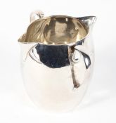 An Edwardian silver double spout cream jug, makers mark JWFGW, London 1902,