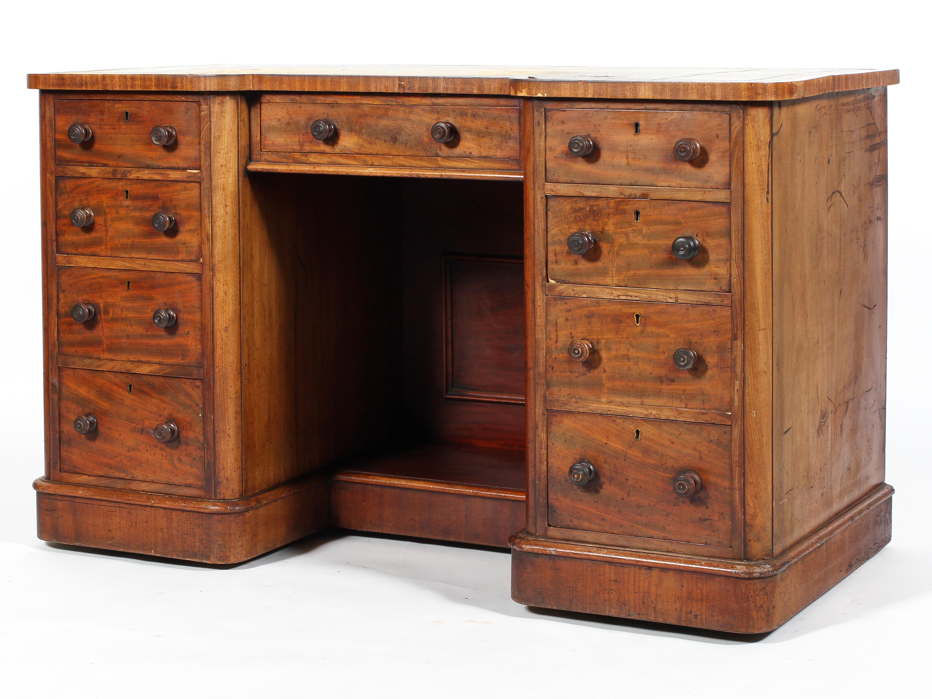 A Victorian mahogany reverse breakfront kneehole desk,