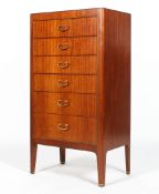 A mahogany slender chest of drawers, 20th century, bearing ivorine label