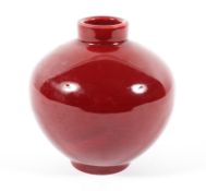 A Chinese porcelain monochrome ox blood red vase, oviform moulded with light ribbing, 20th century,