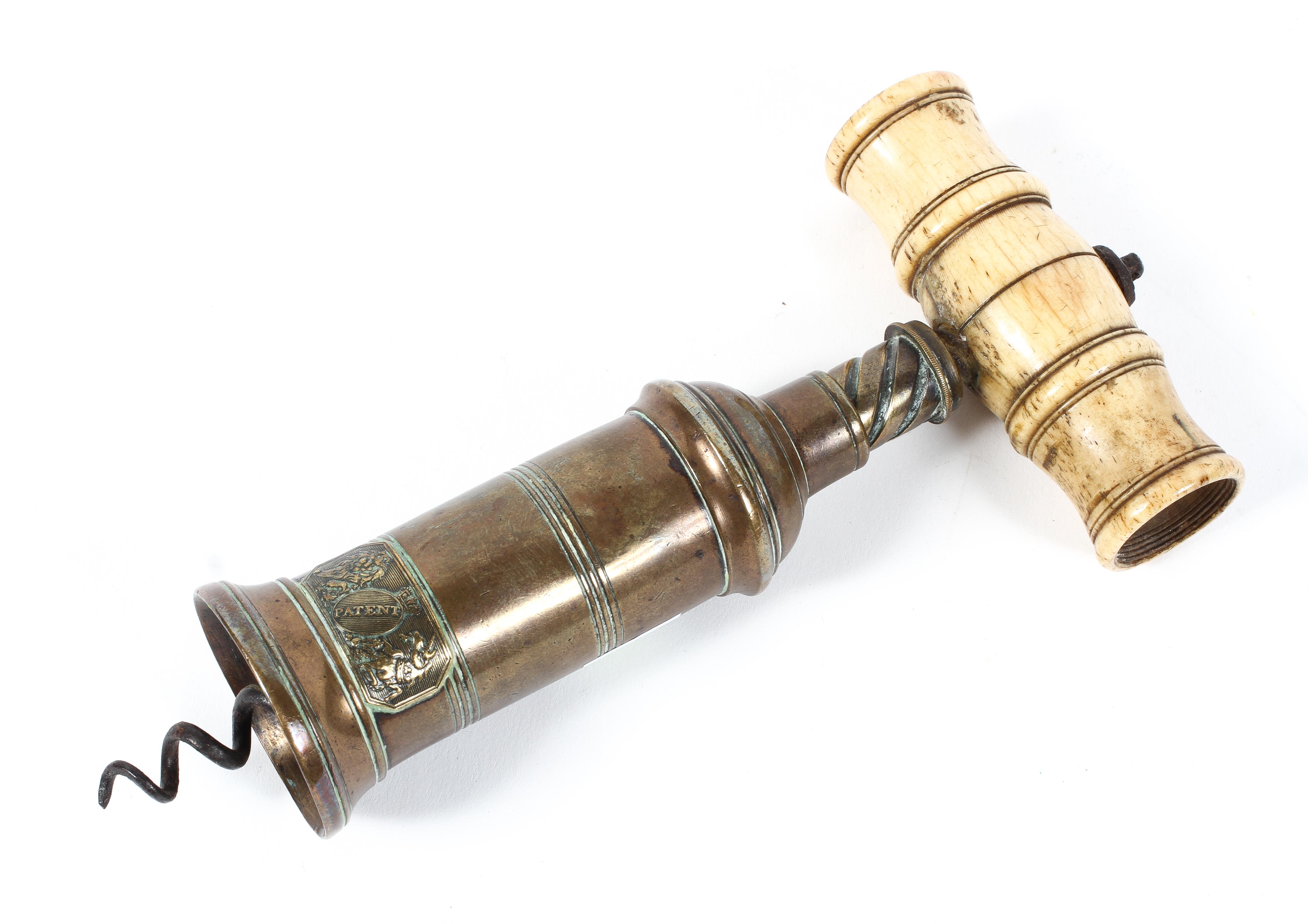 A Georgian brass and ivory mounted corkscrew, applied with a 'patent' Royal Arms plaque, - Image 2 of 2