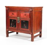 A Chinese lacquered and red painted cabinet,