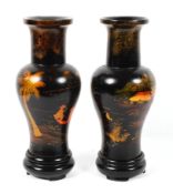 A pair of Chinese lacquered vases on stands, late 19th/early 20th century,