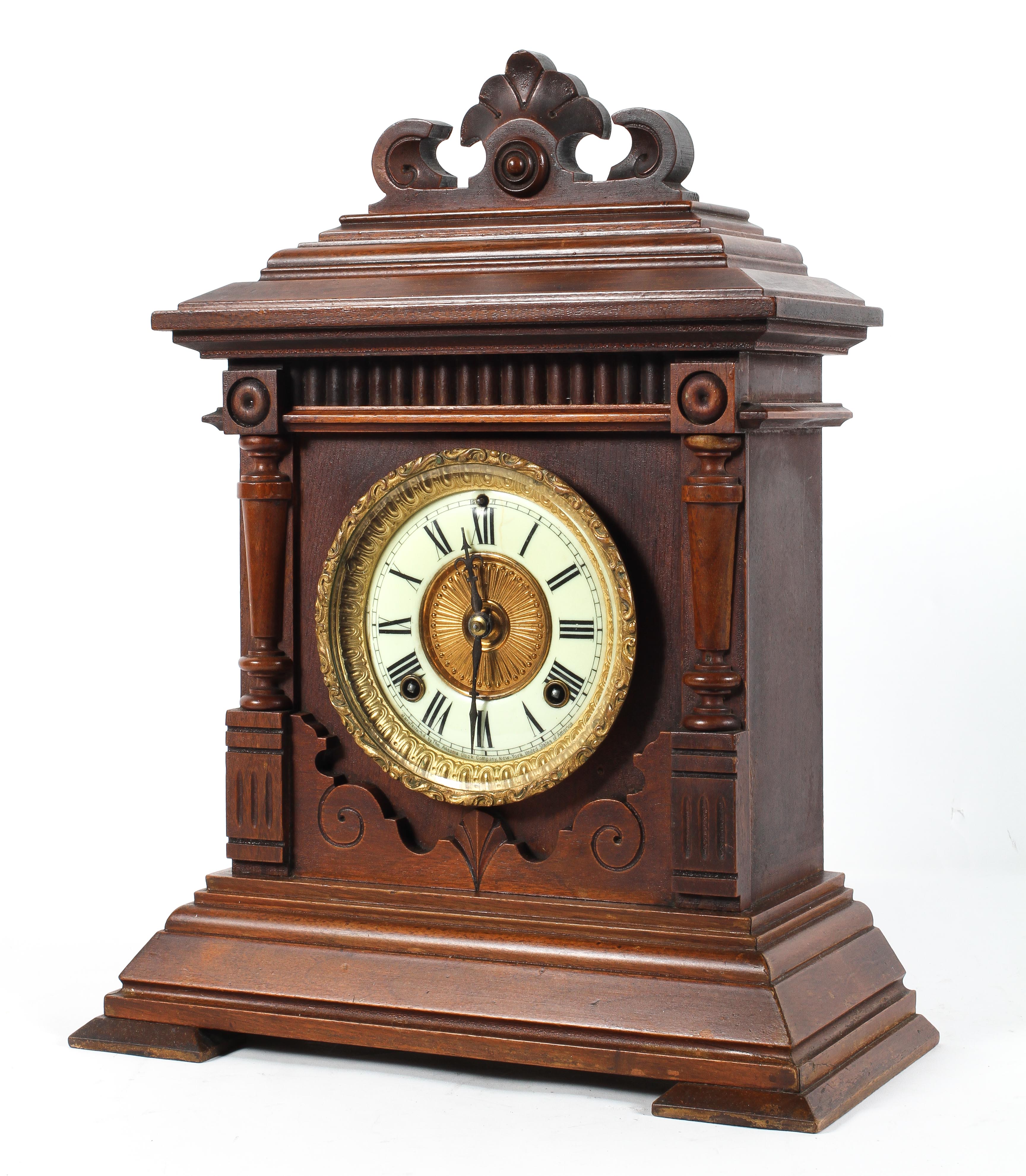 A mahogany cased mantel clock, late 19th century, with a 4 1/2" ivorine dial,