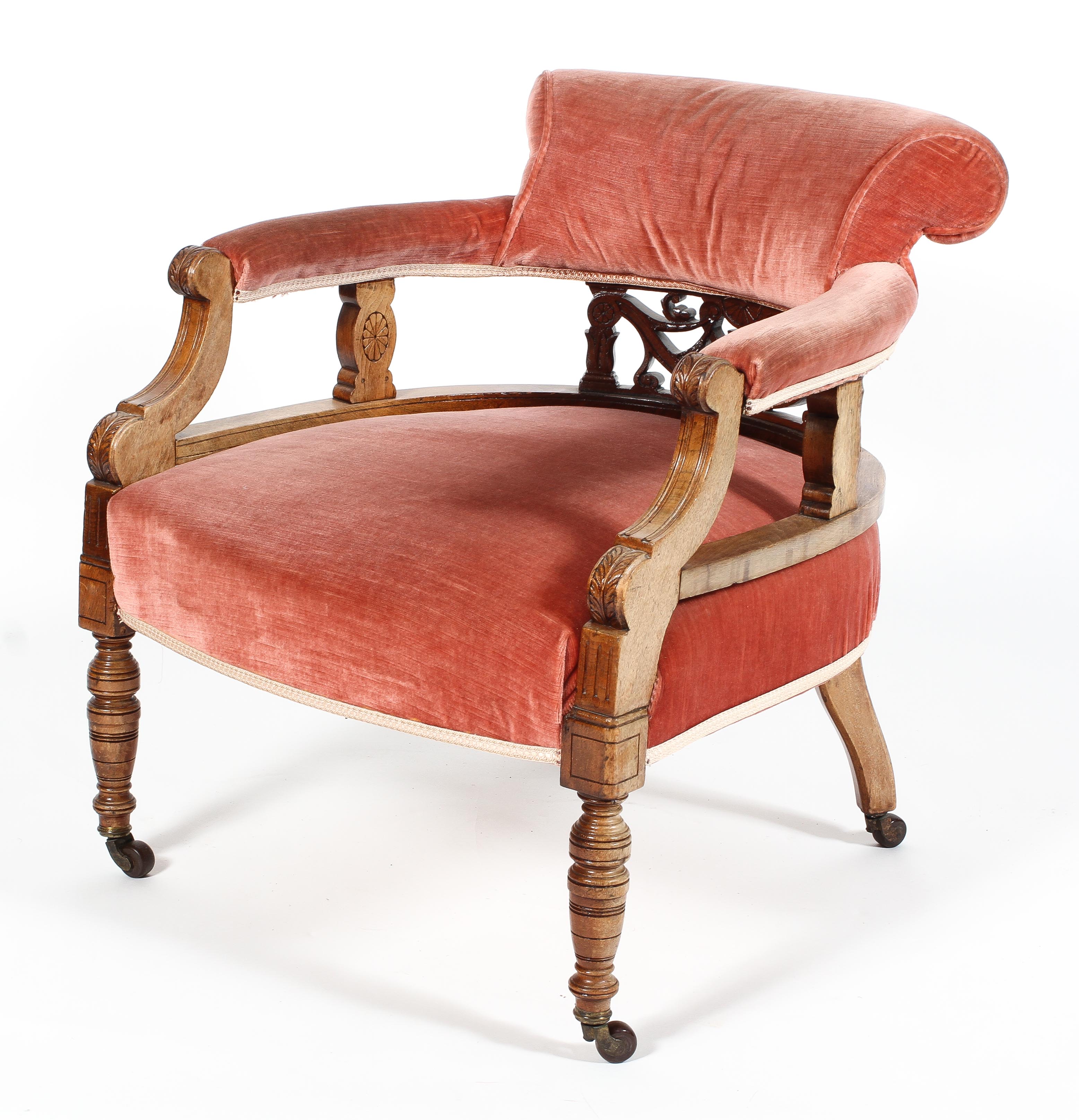 A Victorian oak framed bedroom armchair upholstered in pink velvet, late 19th century,