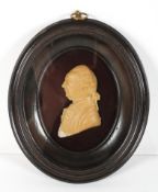 A wax portrait of a gentleman in profile, late 18th century, in moulded ebonised frame,