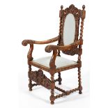 A Victorian carved walnut arm chair,