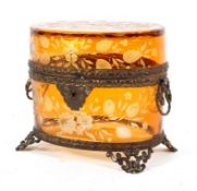 A Bohemian amber glass and gilt metal mounted casket, of oval form,