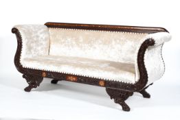 A 19th century style carved and inlaid three seater sofa, 20th century,