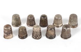 Ten silver thimbles, predominantly late Victorian and later, various designs and shapes,