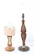 Two mid-century lamps, each with pierced abstract wooden stems,