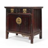 A Chinese hardwood cabinet, with two drawers above two cupboard doors, enclosing a shelf,