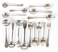 A collection of silver salt and coffee spoons, predominantly Georgian and Victorian,
