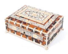 An Anglo-Indian tortoiseshell and ivory casket, 19th century, of sarcophagus form,