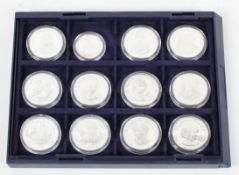 A collection of twelve commemorative silver proof coins, 925/1000, relating to Diana,