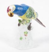 A Meissen parrot, late 20th century, perched on a rocky base, shape 77118, blue crossed sword mark,