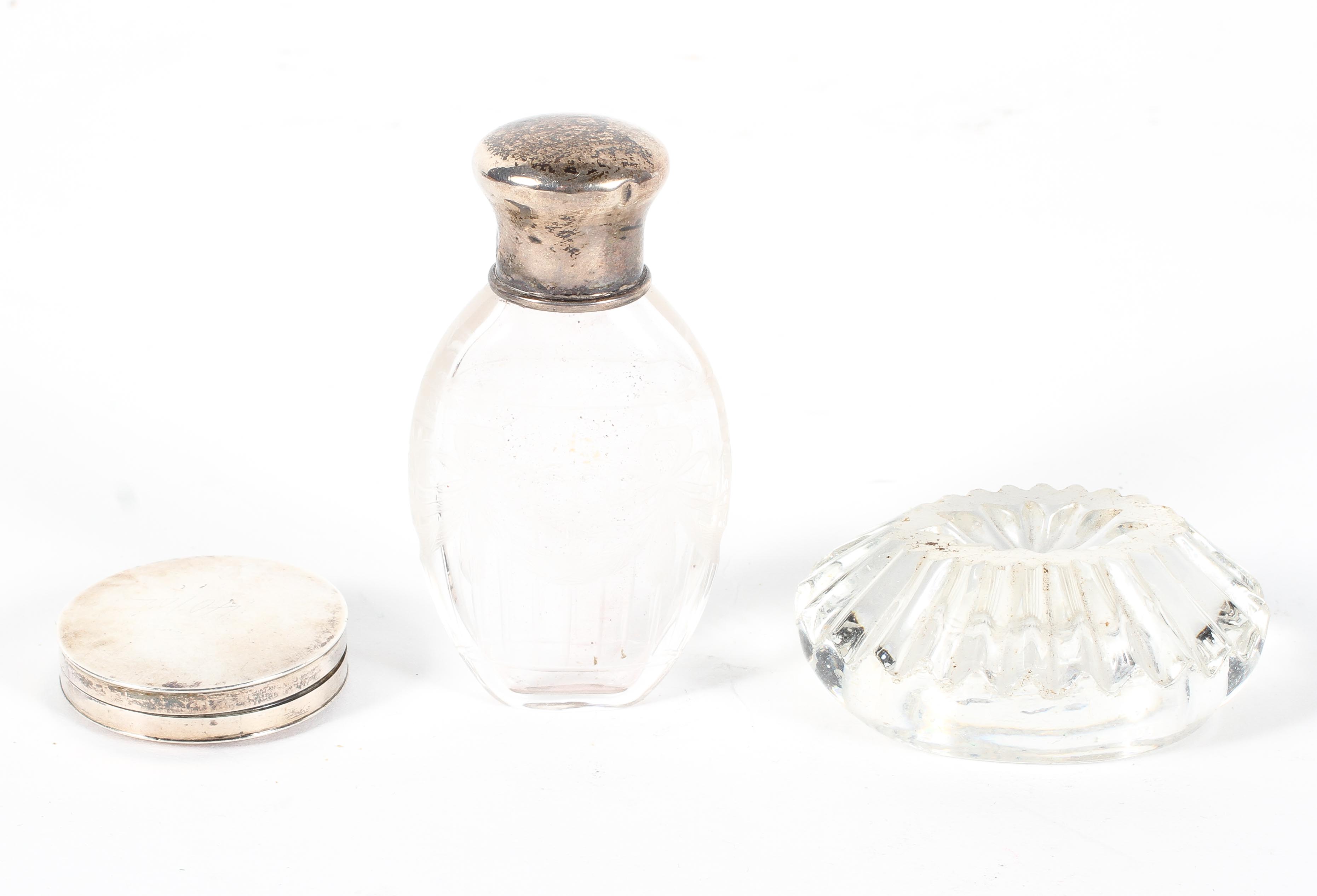 A silver mounted engraved glass scent bottle,