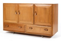 An Ercol blonde elm sideboard,