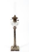 A Hinks and Sons oil lamp, with cut glass reservoir and gilt metal burner,